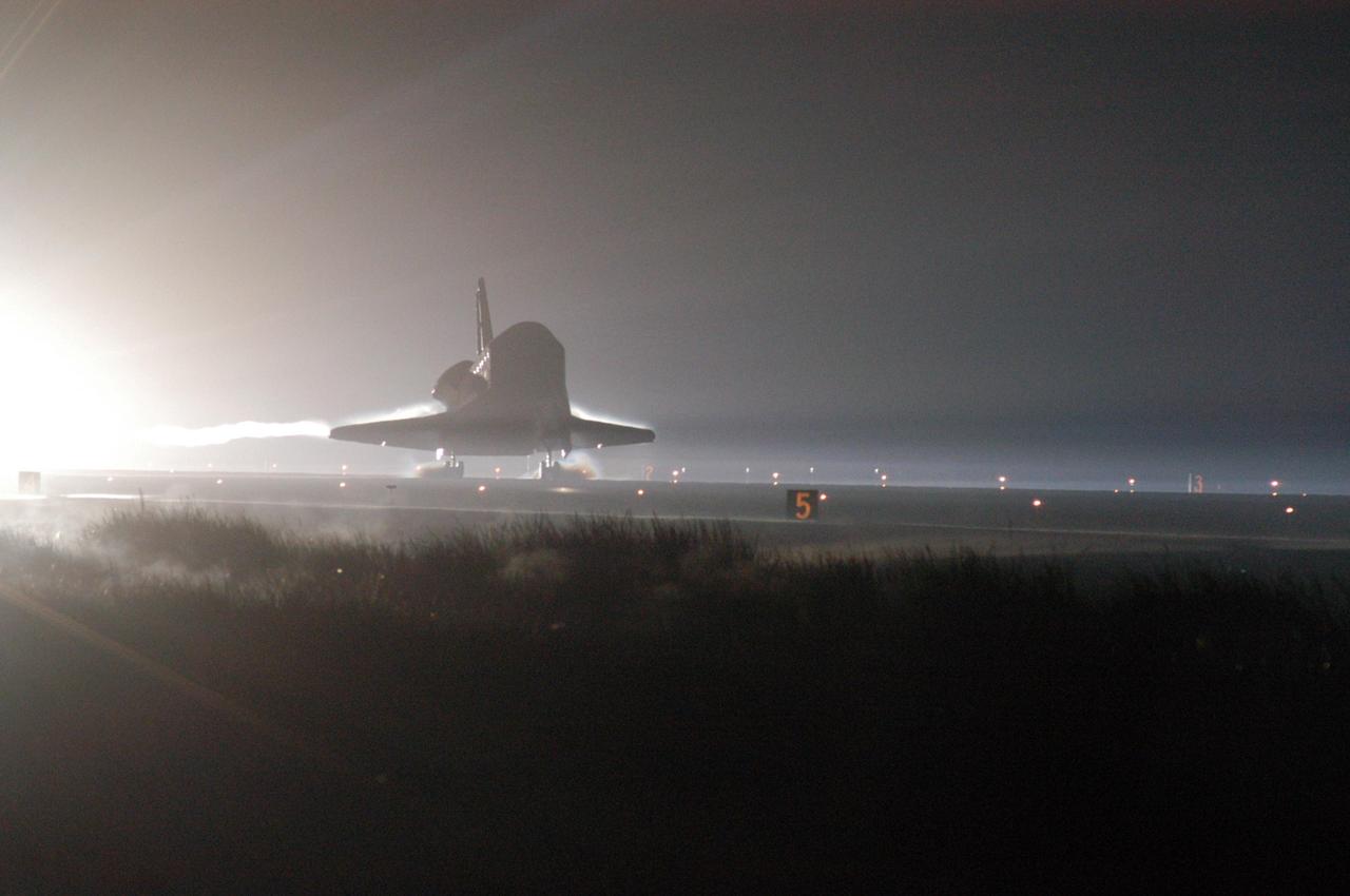 KENNEDY SPACE CENTER, FLA. -   Just before dawn, Atlantis touches down on Runway 33 at NASA's Kennedy Space Center, concluding mission STS-115.  Aboard are Commander Brent Jett, Pilot Christopher Ferguson, and Mission Specialists Joseph Tanner, David Burbank, Heidemarie Stefanyshyn-Piper and Steven MacLean, who represents the Canadian Space Agency.  During the mission, Tanner, McLean, Burbank and Piper completed three spacewalks to attach the P3/P4 integrated truss structure to the International Space Station.  Main gear touchdown was at 6:21:30 a.m. EDT.  Nose gear touchdown was at 6:21:36 a.m. and wheel stop was at 6:22:16 a.m.  At touchdown -- nominally about 2,500 ft. beyond the runway threshold -- the orbiter is traveling at a speed ranging from 213 to 226 mph. Atlantis traveled 4.9 million miles, landing on orbit 187. Mission elapsed time was 11 days, 19 hours, six minutes. This is the 15th night landing at KSC and the 23rd night landing overall.  Photo credit: NASA/George Shelton