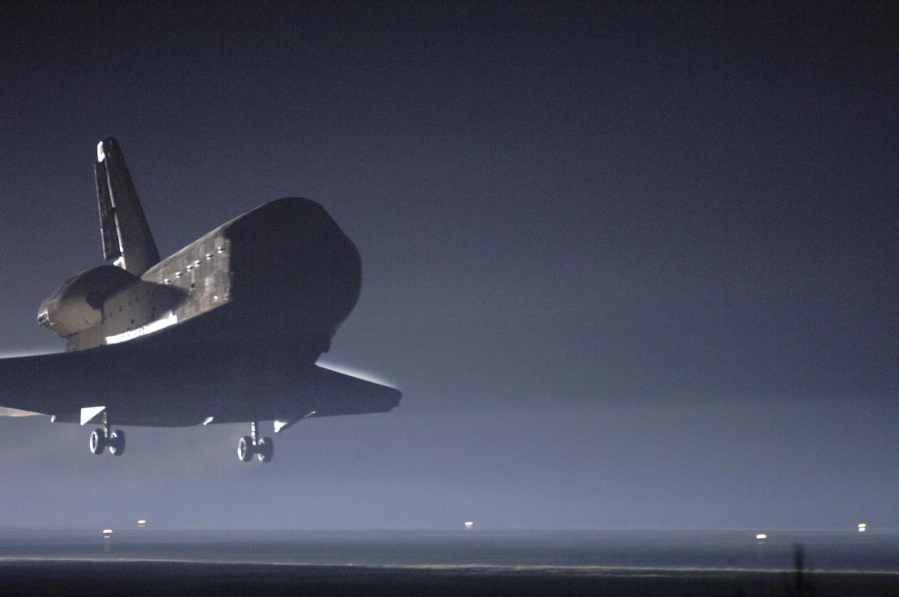 KENNEDY SPACE CENTER, FLA. -   Just before dawn, Atlantis approaches touchdown on Runway 33 at NASA's Kennedy Space Center, concluding mission STS-115.   Aboard are Commander Brent Jett, Pilot Christopher Ferguson, and Mission Specialists Joseph Tanner, David Burbank, Heidemarie Stefanyshyn-Piper and Steven MacLean, who represents the Canadian Space Agency.  During the mission, Tanner, McLean, Burbank and Piper completed three spacewalks to attach the P3/P4 integrated truss structure to the International Space Station.  Main gear touchdown was at 6:21:30 a.m. EDT.  Nose gear touchdown was at 6:21:36 a.m. and wheel stop was at 6:22:16 a.m.  At touchdown -- nominally about 2,500 ft. beyond the runway threshold -- the orbiter is traveling at a speed ranging from 213 to 226 mph. Atlantis traveled 4.9 million miles, landing on orbit 187. Mission elapsed time was 11 days, 19 hours, six minutes. This is the 15th night landing at KSC and the 23rd night landing overall.  Photo credit: NASA/Mike Kerley