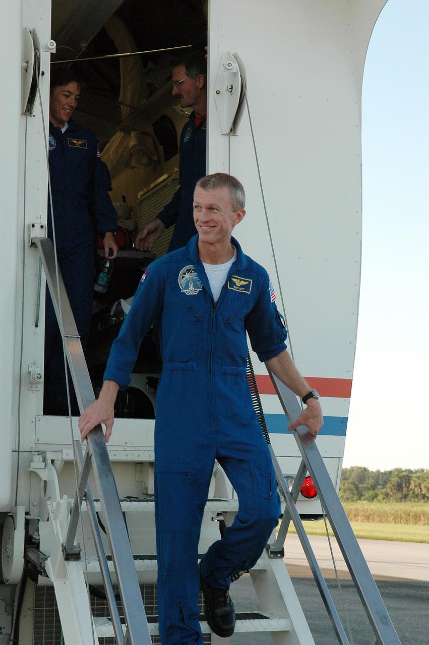 KENNEDY SPACE CENTER, FLA. - After their return from space, the STS-115 crew members are exiting the crew transport vehicle on the Shuttle Landing Facility.  First out is Commander Brent Jett.  Behind him, still inside, are Mission Specialists Heidemarie Stefanyshyn-Piper and Joseph Tanner.  During the mission, astronauts completed three spacewalks to attach the P3/P4 integrated truss structure to the International Space Station.  Main gear touchdown was at 6:21:30 a.m. EDT.  Nose gear touchdown was at 6:21:36 a.m. and wheel stop was at 6:22:16 a.m. At touchdown -- nominally about 2,500 ft. beyond the runway threshold -- the orbiter is traveling at a speed ranging from 213 to 226 mph. Atlantis traveled 4.9 million miles, landing on orbit 187. Mission elapsed time was 11 days, 19 hours, six minutes. This is the 15th night landing at KSC and the 23rd night landing overall.  Photo credit: NASA/Kim Shiflett