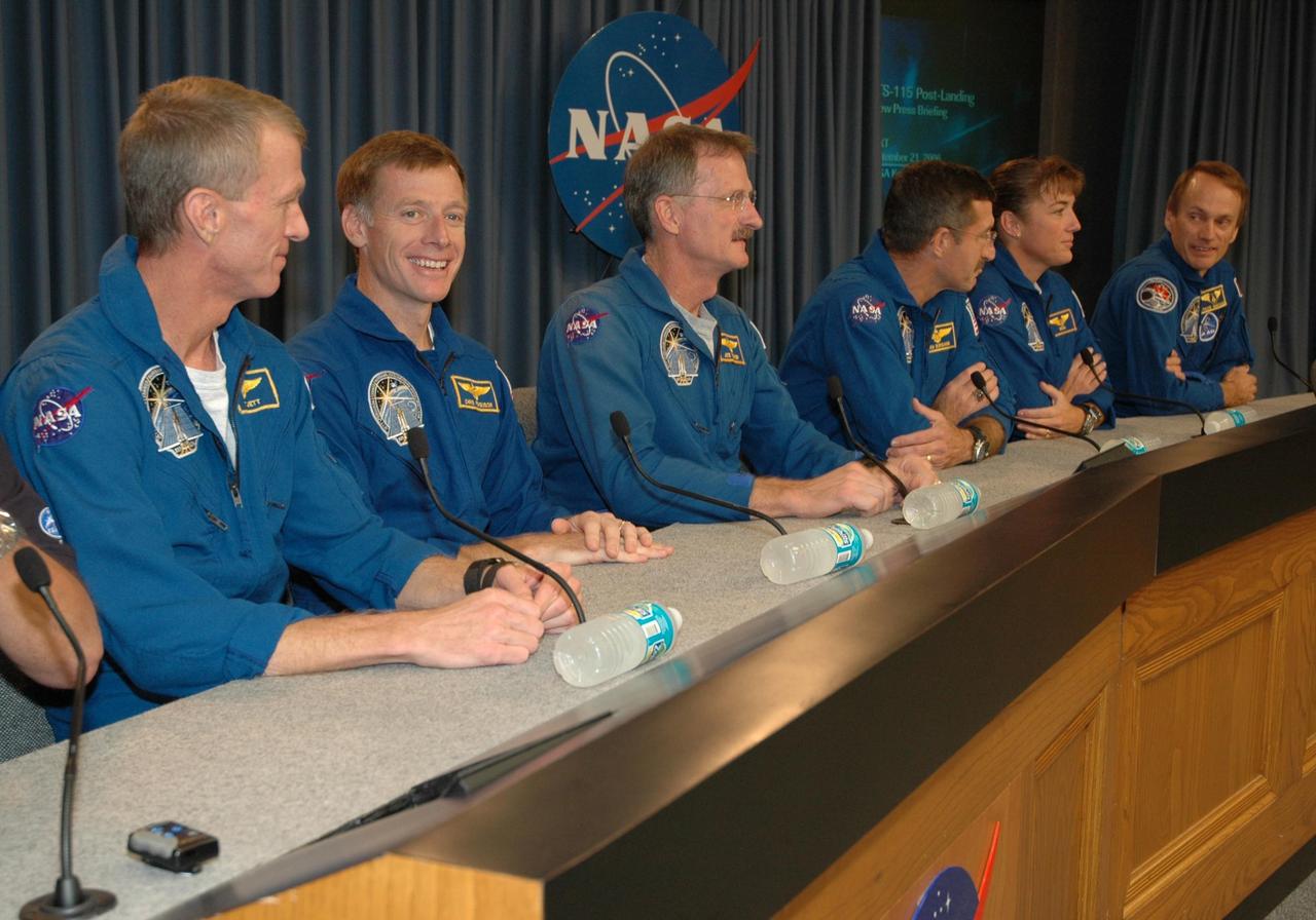 KENNEDY SPACE CENTER, FLA. -  At a post-landing press conference at NASA's Kennedy Space Center, the STS-115 crew answer questions from the media about their mission.  Seated from left are Commander Brent Jett, Pilot Christopher Ferguson, and Mission Specialists Joseph Tanner, Daniel Burbank, Heidemarie Stefanyshyn-Piper and Steven MacLean, who represents the Canadian Space Agency.  During the mission to the International Space Station, astronauts delivered and installed the massive P3/P4 truss, an integral part of the station's backbone, and two sets of solar arrays that will eventually provide one quarter of the station's power. After 11 days, 19 hours and 6 minutes in space, the crew returned to Earth aboard Atlantis at 6:21:30 a.m. EDT.   Photo credit: NASA/Cory Huston