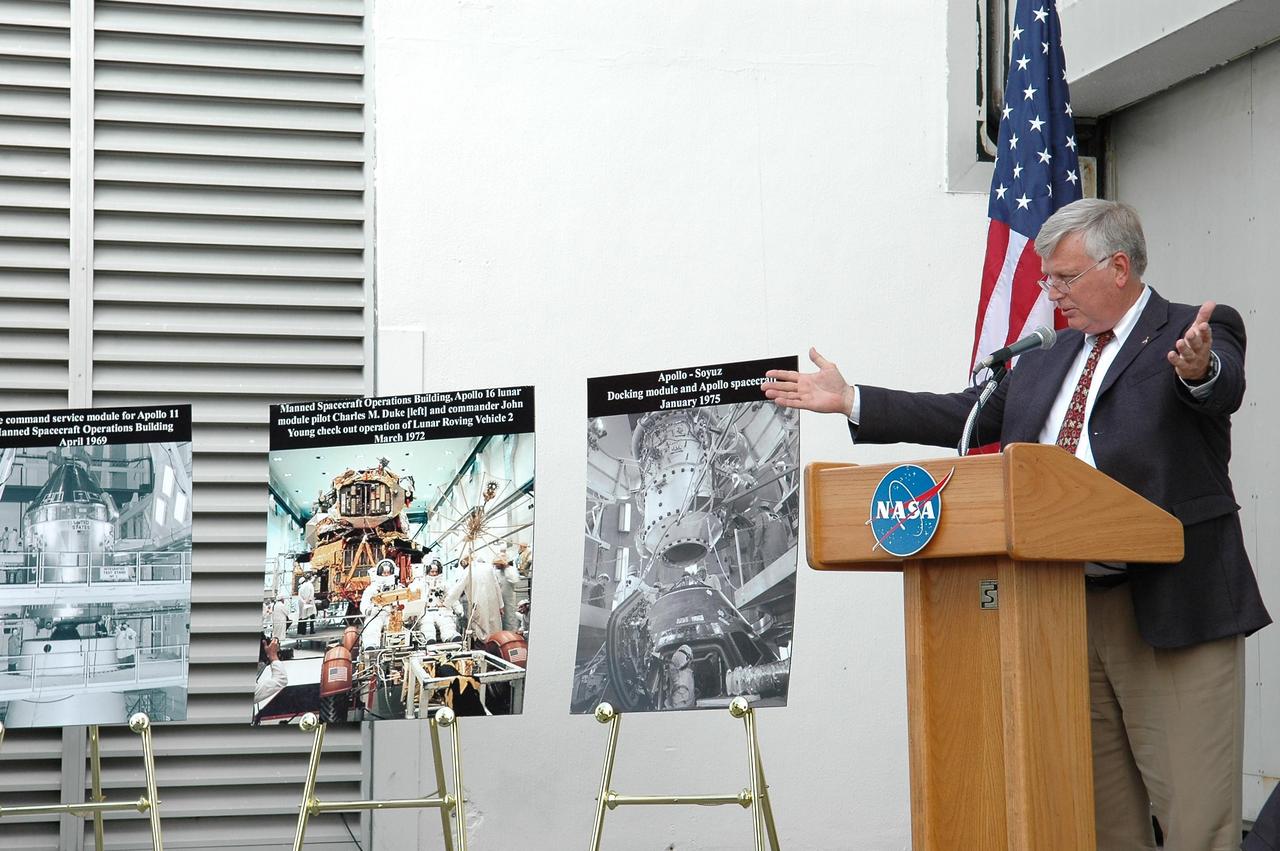 KENNEDY SPACE CENTER, FLA. -  A ribbon-cutting at NASA's Kennedy Space Center officially reactivated the Operations and Checkout Building's west door as entry to the crew exploration vehicle (CEV) environment.  At the podium is Center Director Jim Kennedy, who is discussing KSC's transition from shuttle to CEV in the rest of the decade.  During the rest of the decade, KSC will transition from launching space shuttles to launching new vehicles in NASA’s Vision For Space Exploration. Photo credit: NASA/Kim Shiflett