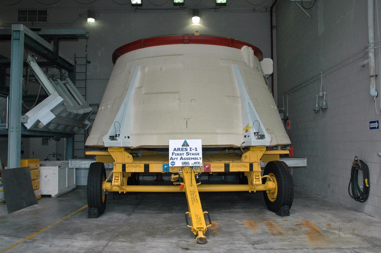 KENNEDY SPACE CENTER, FLA. - In the Assembly and Refurbishment Facility at NASA's Kennedy Space Center, the solid rocket booster aft skirt designated for use on the first stage of the ARES I-1 launch vehicle is being prepared for its first test flight. Ares I is the vehicle being developed for launch of the crew exploration vehicle (CEV), named Orion. Ares I-1 is currently targeted for launch from Launch Pad 39B in 2009 using the SRB first stage and a simulated second stage and simulated CEV. Ares I ascent tests and Ares I orbital tests will also take place at Kennedy at later dates. Photo credit: NASA/Jack Pfaller