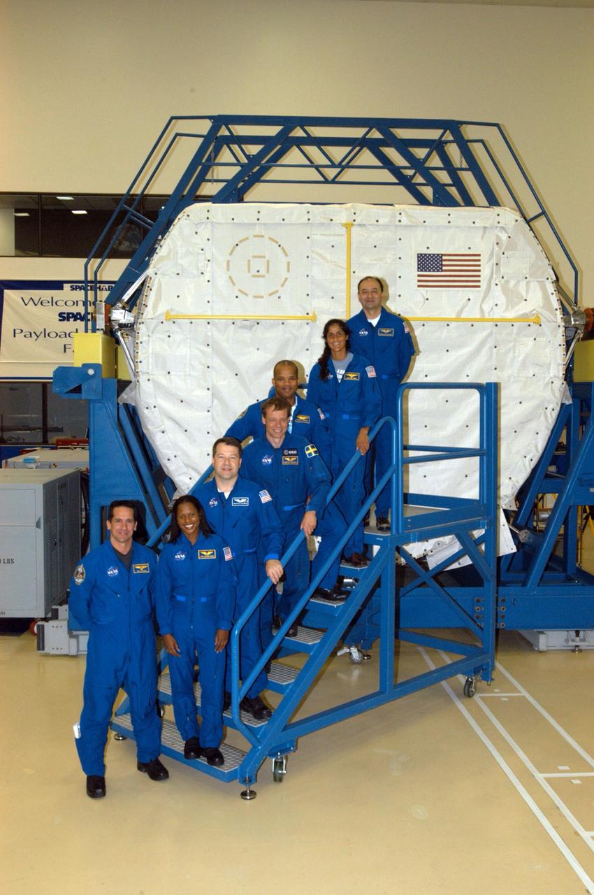 KENNEDY SPACE CENTER, FLA. -  At SPACEHAB in Cape Canaveral, Fla., the STS-116 crew  takes a break from equipment familiarization to pose for a group photo.  From bottom to top are Pilot William Oefelein, Mission Specialists Joan Higginbotham, Nicholas Patrick, Robert Curbeam,  Christer Fuglesang and Sunita Williams, and Commander Mark Polansky.  The Swedish Fuglesang represents the European Space Agency.  Mission crews make frequent trips to the Space Coast to become familiar with the equipment and payloads they will be using.  STS-116 will be mission number 20 to the International Space Station and construction flight 12A.1.  The mission payload is the SPACEHAB module, the P5 integrated truss structure and other key components.   Launch is scheduled for no earlier than Dec. 7.  Photo credit: NASA/George Shelton