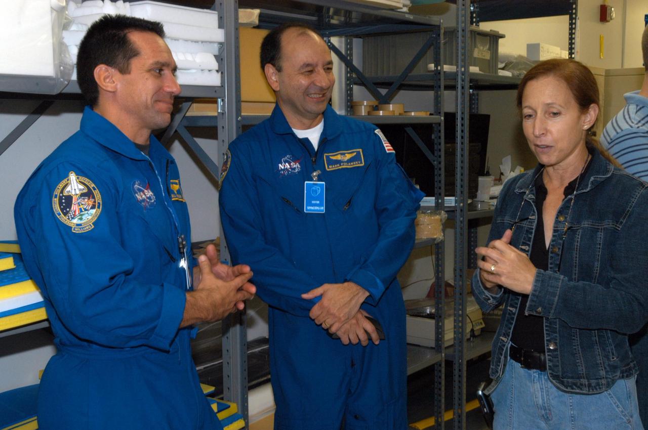 KENNEDY SPACE CENTER, FLA. -  At SPACEHAB in Cape Canaveral, Fla., STS-116 Pilot William Oefelein and Commander Mark Polansky relax during equipment familiarization to talk to astronaut Marsha Ivins, who is currently assigned to the Astronaut Office, Space Station/Shuttle Branches for crew equipment, habitability and stowage.   Mission crews make frequent trips to the Space Coast to become familiar with the equipment and payloads they will be using.  STS-116 will be mission number 20 to the International Space Station and construction flight 12A.1.  The mission payload is the SPACEHAB module, the P5 integrated truss structure and other key components.   Launch is scheduled for no earlier than Dec. 7.  Photo credit: NASA/George Shelton