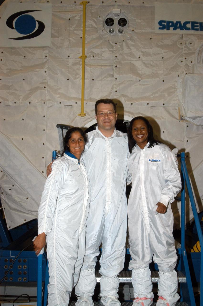 KENNEDY SPACE CENTER, FLA. -  At SPACEHAB in Cape Canaveral, Fla., the STS-116 crew  takes a break from equipment familiarization in the SPACEHAB module to pose for a group photo.  From left are Mission Specialists Sunita Williams, Nicholas Patrick and Joan Higginbotham.   Mission crews make frequent trips to the Space Coast to become familiar with the equipment and payloads they will be using.  STS-116 will be mission number 20 to the International Space Station and construction flight 12A.1.  The mission payload is the SPACEHAB module, the P5 integrated truss structure and other key components.   Launch is scheduled for no earlier than Dec. 7.  Photo credit: NASA/George Shelton