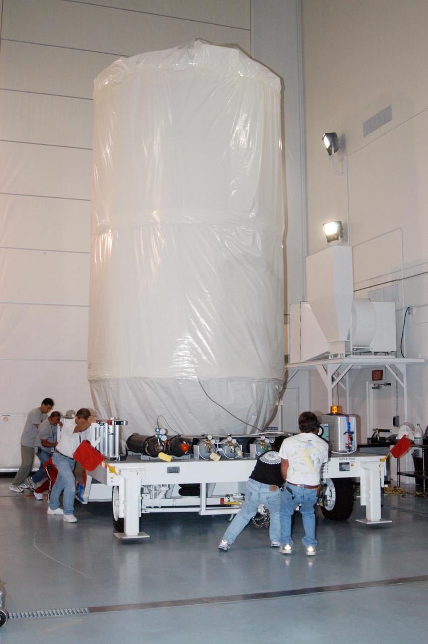 KENNEDY SPACE CENTER, FLA. - At Astrotech Space Operations in Titusville, Fla., the STEREO spacecraft is being moved out of the high bay. A truck will transport the spacecraft to Launch Pad 17-B on Cape Canaveral Air Force Station where it will be lifted into the mobile service tower. STEREO stands for Solar Terrestrial Relations Observatory and comprises two spacecraft. The STEREO mission is the first to take measurements of the sun and solar wind in 3-dimension. This new view will improve our understanding of space weather and its impact on the Earth. The STEREO mission is managed by Goddard. The Applied Physics Laboratory designed and built the spacecraft. The laboratory will maintain command and control of the observatories throughout the mission, while NASA tracks and receives the data, determines the orbit of the satellites, and coordinates the science results. STEREO is expected to lift off Oct. 25. Photo credit: NASA/George Shelton