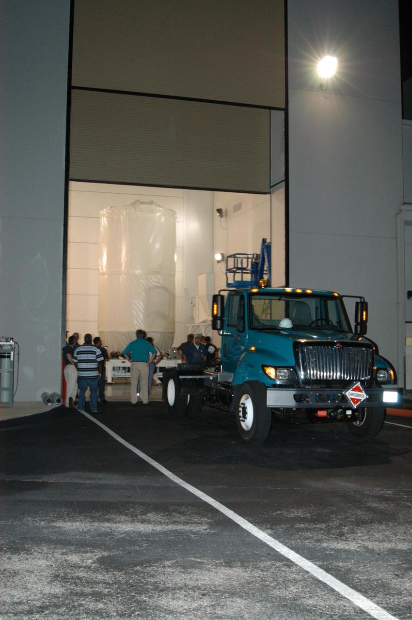 KENNEDY SPACE CENTER, FLA. - At Astrotech Space Operations in Titusville, Fla., the transporter carrying the STEREO spacecraft is secured to the truck that will transport it to Launch Pad 17-B on Cape Canaveral Air Force Station. At the pad, the spacecraft will be lifted into the mobile service tower. STEREO stands for Solar Terrestrial Relations Observatory and comprises two spacecraft. The STEREO mission is the first to take measurements of the sun and solar wind in 3-dimension. This new view will improve our understanding of space weather and its impact on the Earth. The STEREO mission is managed by Goddard Space Flight Center. The Applied Physics Laboratory designed and built the spacecraft. The laboratory will maintain command and control of the observatories throughout the mission, while NASA tracks and receives the data, determines the orbit of the satellites, and coordinates the science results. STEREO is expected to lift off Oct. 25. Photo credit: NASA/George Shelton