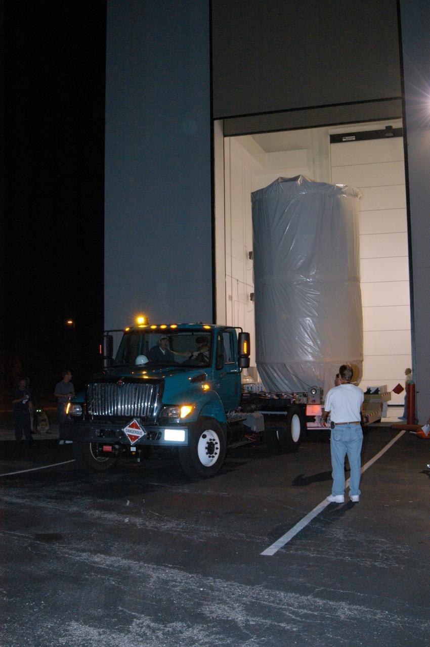 KENNEDY SPACE CENTER, FLA. - At Astrotech Space Operations in Titusville, Fla., the transporter carrying the STEREO spacecraft is attached to the truck for transportation to Launch Pad 17-B on Cape Canaveral Air Force Station. At the pad the spacecraft will be lifted into the mobile service tower. STEREO stands for Solar Terrestrial Relations Observatory and comprises two spacecraft. The STEREO mission is the first to take measurements of the sun and solar wind in 3-dimension. This new view will improve our understanding of space weather and its impact on the Earth. The STEREO mission is managed by Goddard Space Flight Center. The Applied Physics Laboratory designed and built the spacecraft. The laboratory will maintain command and control of the observatories throughout the mission, while NASA tracks and receives the data, determines the orbit of the satellites, and coordinates the science results. STEREO is expected to lift off Oct. 25. Photo credit: NASA/George Shelton
