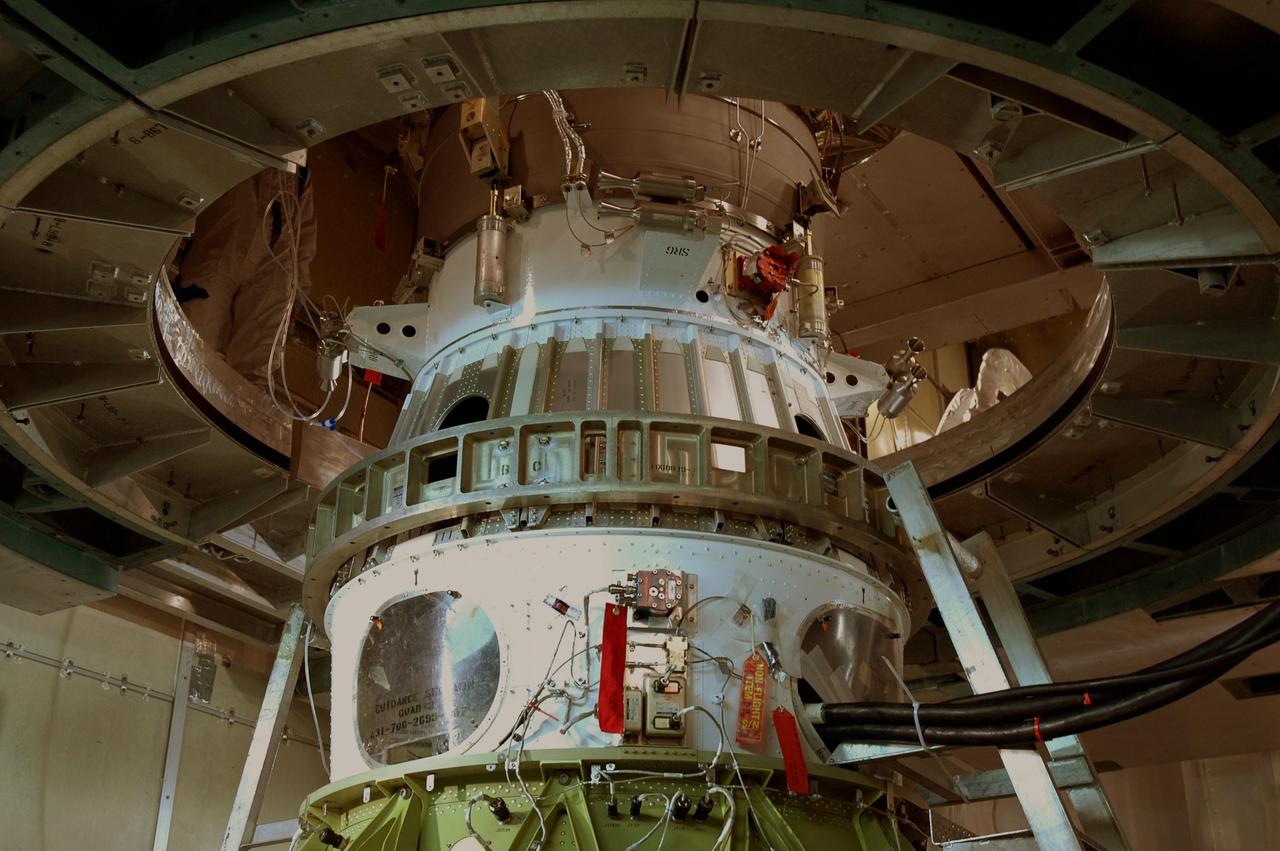 KENNEDY SPACE CENTER, FLA. - Inside the mobile service tower on Launch Pad 17-B at Cape Canaveral Air Force Station, the transportation canister and protective cover have been removed from the STEREO spacecraft in preparation for launch. The scheduled launch date is Oct. 25. STEREO stands for Solar Terrestrial Relations Observatory and comprises two spacecraft that will launch in a piggyback mode, separating after reaching the appropriate orbit. The STEREO mission is the first to take measurements of the sun and solar wind in 3-dimension. This new view will improve our understanding of space weather and its impact on the Earth. The STEREO mission is managed by Goddard. The Applied Physics Laboratory designed and built the spacecraft. The laboratory will maintain command and control of the observatories throughout the mission, while NASA tracks and receives the data, determines the orbit of the satellites, and coordinates the science results. Photo credit: NASA/Jim Grossmann