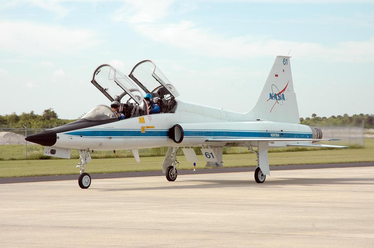 KENNEDY SPACE CENTER, FLA. -  STS-116 Mission Specialist Robert Curbeam (in back) arrives at Kennedy Space Center’s Shuttle Landing Facility aboard a T-38 jet for the Crew Equipment Interface Test. Mission crews make frequent trips to the Space Coast to become familiar with the equipment and payloads they will be using. STS-116 will be mission No. 20 to the International Space Station and construction flight 12A.1. The mission payload is the SPACEHAB module, the P5 integrated truss structure and other key components.  Launch is scheduled for no earlier than Dec. 7.  Photo credit: NASA/Kim Shiflett