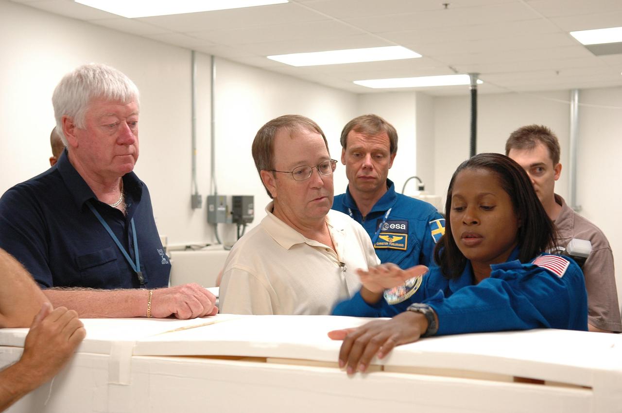KENNEDY SPACE CENTER, FLA. - STS-116 Mission Specialists Joan Higgenbotham and Christer Fuglesang, who is with the European Space Agency, inspect flight hardware at the SPACEHAB Payload Processing Facility at Port Canaveral, Fla., during the Crew Equipment Interface Test. Mission crews make frequent trips to the Space Coast to become familiar with the equipment and payloads they will be using. STS-116 will be mission No. 20 to the International Space Station and construction flight 12A.1. The mission payload is the SPACEHAB module, the P5 integrated truss structure and other key components. Launch is scheduled for no earlier than Dec. 7. Photo credit: NASA/Kim Shiflett