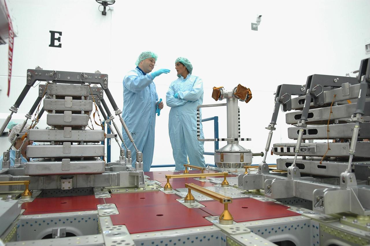 KENNEDY SPACE CENTER, FLA. - Inside Astrotech Space Operations in Titusville, Fla., STS-116 Mission Specialists Nicholas Patrick and Sunita Williams are inspecting flight hardware during the Crew Equipment Interface Test. Mission crews make frequent trips to the Kennedy Space Center to become familiar with the equipment and payloads they will be using. STS-116 will be mission No. 20 to the International Space Station and construction flight 12A.1. The mission payload is the SPACEHAB module, the P5 integrated truss structure and other key components. Launch is scheduled for no earlier than Dec. 7. Photo credit: NASA/Kim Shiflett