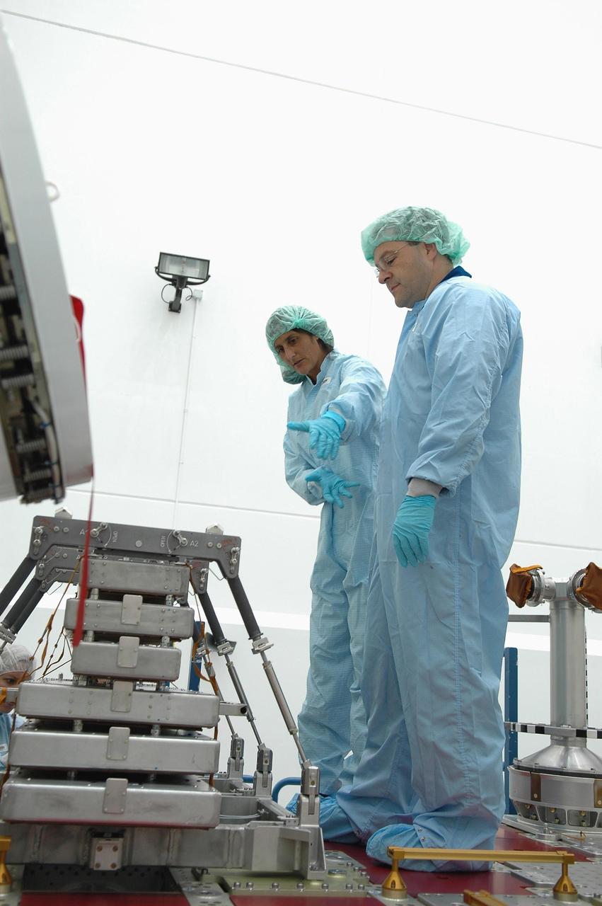 KENNEDY SPACE CENTER, FLA. - Inside Astrotech Space Operations in Titusville, Fla., STS-116 Mission Specialists Sunita Williams and Nicholas Patrick are inspecting flight hardware during the Crew Equipment Interface Test. Mission crews make frequent trips to the Kennedy Space Center to become familiar with the equipment and payloads they will be using. STS-116 will be mission No. 20 to the International Space Station and construction flight 12A.1. The mission payload is the SPACEHAB module, the P5 integrated truss structure and other key components. Launch is scheduled for no earlier than Dec. 7. Photo credit: NASA/Kim Shiflett