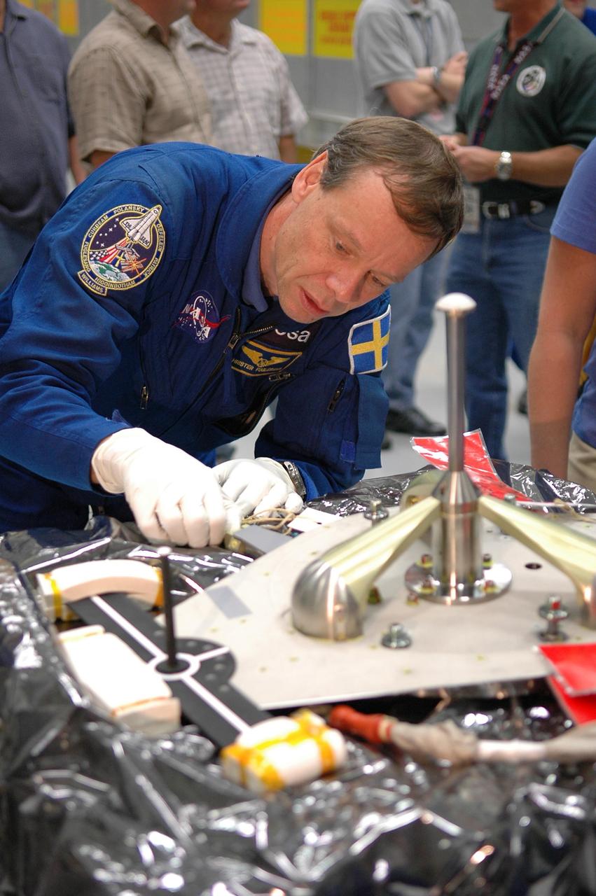 KENNEDY SPACE CENTER, FLA. -   In the Orbiter Processing Facility, STS-116 Mission Specialist Christer Fugelsang, who represents the European Space Agency, gets hands-on experience working with a piece of flight hardware. He and other crew members are at KSC for a Crew Equipment Interface Test.   Mission crews make frequent trips to the Kennedy Space Center to become familiar with the equipment and payloads they will be using.  STS-116 will be mission No. 20 to the International Space Station and construction flight 12A.1.  The mission payload is the SPACEHAB module, the P5 integrated truss structure and other key components.   Launch is scheduled for no earlier than Dec. 7.  Photo credit: NASA/Kim Shiflett