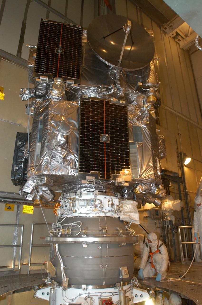 KENNEDY SPACE CENTER, FLA. -   Inside the mobile service tower on Launch Pad 17-B at Cape Canaveral Air Force Station, workers prepare the twin observatories known as STEREO for encapsulation in the fairing.   The fairing is a molded structure that fits flush with the outside surface of the Delta II upper stage booster and forms an aerodynamically smooth nose cone, protecting the spacecraft during launch and ascent. The STEREO (Solar Terrestrial Relations Observatory) mission is the first to take measurements of the sun and solar wind in 3-dimension. This new view will improve our understanding of space weather and its impact on the Earth.  Designed and built by the Applied Physics Laboratory (APL) , the STEREO mission is being managed by NASA Goddard Space Flight Center. APL will maintain command and control of the observatories throughout the mission, while NASA tracks and receives the data, determines the orbit of the satellites, and coordinates the science results. STEREO is expected to lift off Oct. 25. Photo credit: NASA/George Shelton