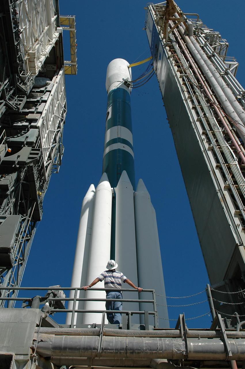 KENNEDY SPACE CENTER, FLA. -   The mobile service tower (left) rolls away from the STEREO spacecraft aboard the Delta II launch vehicle in preparation for launch.  Liftoff is scheduled in a window between 8:38 and 8:53 p.m. on Oct. 25.  STEREO (Solar Terrestrial Relations Observatory) is a two-year mission using two nearly identical observatories, one ahead of Earth in its orbit and the other trailing behind.  The duo will provide 3-D measurements of the sun and its flow of energy, enabling scientists to study the nature of coronal mass ejections and why they happen.  The ejections are a major source of the magnetic disruptions on Earth and are a key component of space weather.  The disruptions can greatly effect satellite operations, communications, power systems, humans in space and global climate.  Designed and built by the Johns Hopkins University Applied Physics Laboratory (APL) , the STEREO mission is being managed by NASA Goddard Space Flight Center. APL will maintain command and control of the observatories throughout the mission, while NASA tracks and receives the data, determines the orbit of the satellites, and coordinates the science results. Photo credit: NASA/Kim Shiflett