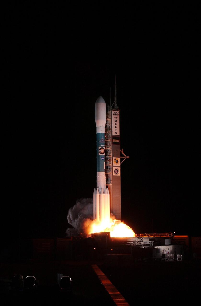 KENNEDY SPACE CENTER, FLA. - At liftoff, clouds of smoke spread beneath the Delta II rocket carrying the STEREO spacecraft on top.  Liftoff from Launch Pad 17-B at Cape Canaveral Air Force Station was at 8:52 p.m. EDT.  STEREO (Solar Terrestrial Relations Observatory) is a two-year mission using two nearly identical observatories, one ahead of Earth in its orbit and the other trailing behind.  The duo will provide 3-D measurements of the sun and its flow of energy, enabling scientists to study the nature of coronal mass ejections and why they happen.  The ejections are a major source of the magnetic disruptions on Earth and are a key component of space weather.  The disruptions can greatly effect satellite operations, communications, power systems, humans in space and global climate.  Designed and built by the Johns Hopkins University Applied Physics Laboratory (APL) , the STEREO mission is being managed by NASA Goddard Space Flight Center. APL will maintain command and control of the observatories throughout the mission, while NASA tracks and receives the data, determines the orbit of the satellites, and coordinates the science results.