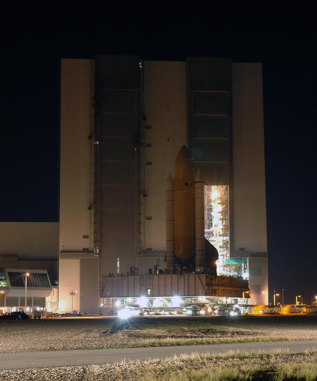 KENNEDY SPACE CENTER, FLA. -- Space Shuttle Discovery rolls out of high bay 3 of the Vehicle Assembly Building for the long, slow journey to Launch Pad 39B and launch of mission STS-116. The mission is No. 20 to the International Space Station and construction flight 12A.1. The mission payload is the SPACEHAB module, the P5 integrated truss structure and other key components. The launch window for mission STS-116 opens Dec. 7. Photo credit: NASA/Amanda Diller