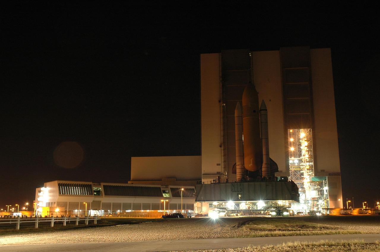 KENNEDY SPACE CENTER, FLA. -- Space Shuttle Discovery rolls out of high bay 3 of the Vehicle Assembly Building for the long, slow journey to Launch Pad 39B and launch of mission STS-116. The mission is No. 20 to the International Space Station and construction flight 12A.1. The mission payload is the SPACEHAB module, the P5 integrated truss structure and other key components. The launch window for mission STS-116 opens Dec. 7. Photo credit: NASA/Amanda Diller