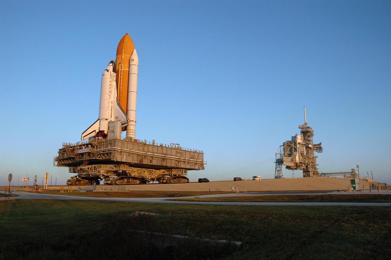 KENNEDY SPACE CENTER, FLA. --  Space Shuttle Discovery, atop the mobile launcher platform and moved by the crawler-transporter underneath, makes its final approach up the ramp to Launch Pad 39B for launch of mission STS-116. The mission is No. 20 to the International Space Station and construction flight 12A.1. The mission payload is the SPACEHAB module, the P5 integrated truss structure and other key components. The launch window for mission STS-116 opens Dec. 7. Photo credit: NASA/Amanda Diller