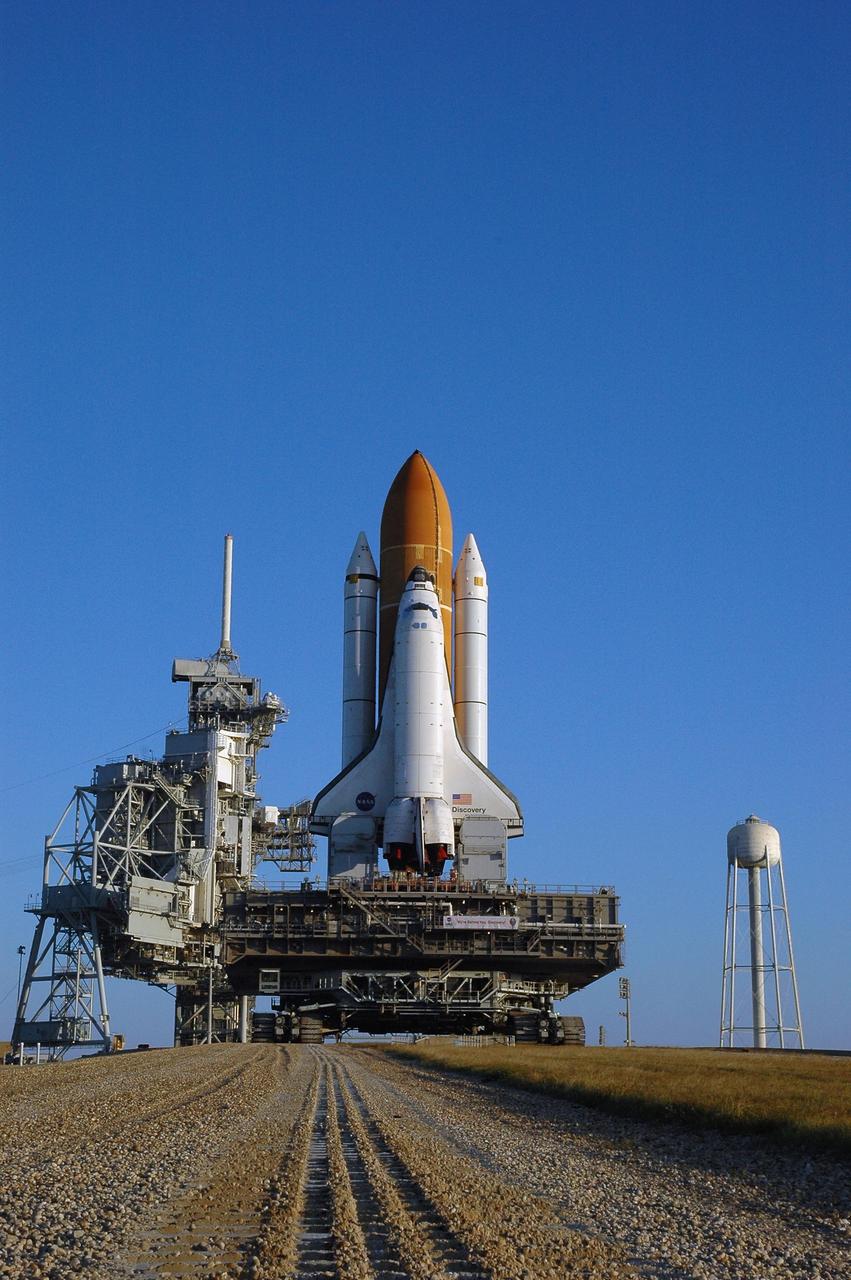 KENNEDY SPACE CENTER, FLA. --  Space Shuttle Discovery, atop the mobile launcher platform and the crawler-transporter underneath, arrives on Launch Pad 39B for launch of mission STS-116. The mission is No. 20 to the International Space Station and construction flight 12A.1. The mission payload is the SPACEHAB module, the P5 integrated truss structure and other key components. The launch window for mission STS-116 opens Dec. 7. Photo credit: NASA/Amanda Diller