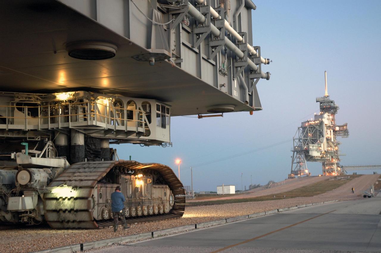 KENNEDY SPACE CENTER, FLA. --  A closeup of the crawler-transporter underneath the mobile launcher platform with Space Shuttle Discovery on top as they approach the ramp to Launch Pad 39B for launch of mission STS-116. The mission is No. 20 to the International Space Station and construction flight 12A.1. The mission payload is the SPACEHAB module, the P5 integrated truss structure and other key components. The launch window for mission STS-116 opens Dec. 7. Photo credit: NASA/Jim Grossmann
