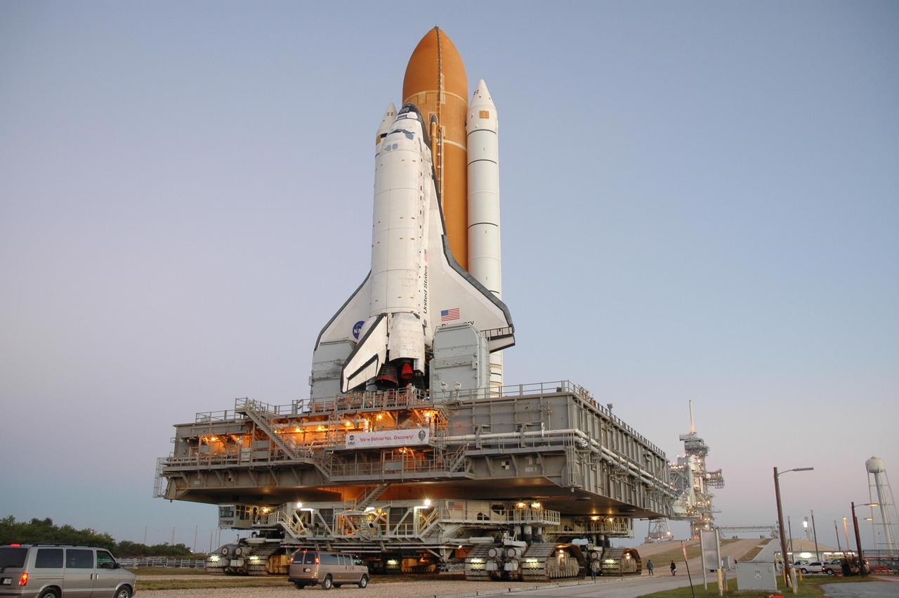 KENNEDY SPACE CENTER, FLA. -- Space Shuttle Discovery, on top of the mobile launcher platform and crawler-transporter, approaches the ramp to Launch Pad 39B for launch of mission STS-116. The rollout from the Vehicle Assembly Building began at 12:29 a.m. The mission is No. 20 to the International Space Station and construction flight 12A.1. The mission payload is the SPACEHAB module, the P5 integrated truss structure and other key components. The launch window for mission STS-116 opens Dec. 7. Photo credit: NASA/Jim Grossmann