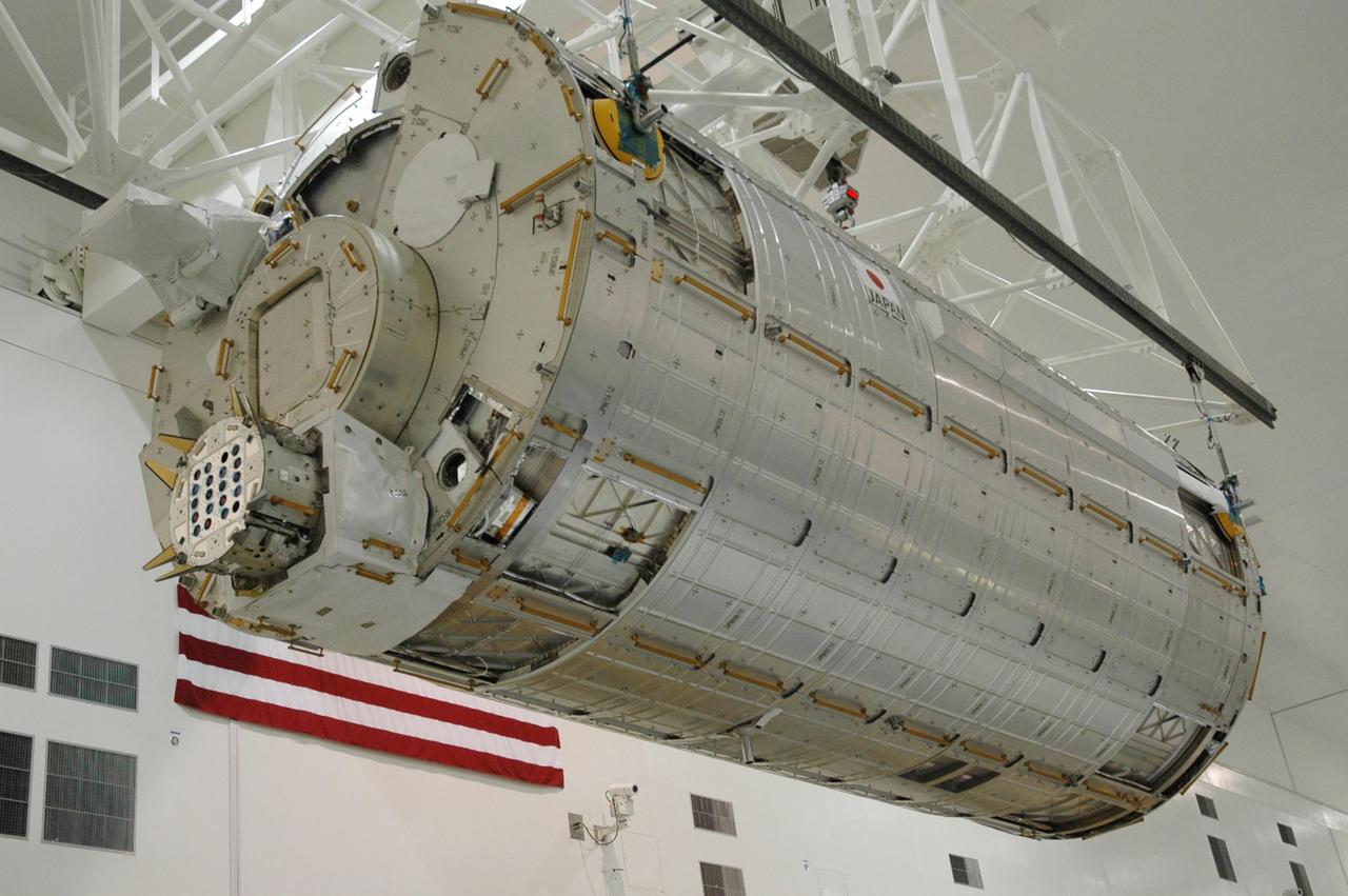KENNEDY SPACE CENTER, FLA. --  In the Space Station Processing Facility, the Japanese Experiment Module (JEM), after being weighed, makes a return trip to its transporter.  The Japanese Aerospace Exploration Agency developed the laboratory at the Tsukuba Space Center near Tokyo. It is the first element, named "Kibo" (Hope), to be delivered to KSC. The JEM is Japan's primary contribution to the International Space Station. It will enhance the unique research capabilities of the orbiting complex by providing an additional environment for astronauts to conduct science experiments. The JEM is targeted for mission STS-124, to launch in early 2008.  Photo credit: NASA/Troy Cryder
