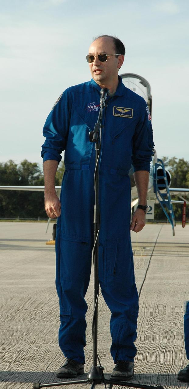 KENNEDY SPACE CENTER, FLA. -- After arrival at the Shuttle Landing Facility, STS-116 Commander Mark Polansky talks to the media.  He and Mission Specialists Sunita Williams, Joan Higginbotham and Nicholas Patrick, Polansky, Pilot William Oefelein, and Mission Specialists Robert Curbeam and Christer Fuglesang have returned to KSC for the terminal countdown demonstration test, which are prelaunch preparations that include a simulated launch countdown. Fugelsang, who is from Sweden, represents the European Space Agency.  The mission is No. 20 to the International Space Station and construction flight 12A.1.  The mission payload is the SPACEHAB module, the P5 integrated truss structure and other key components. Launch is scheduled for no earlier than Dec. 7. Photo credit: NASA/Kim Shiflett