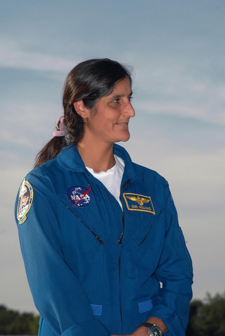 KENNEDY SPACE CENTER, FLA. -- After arrival at the Shuttle Landing Facility, STS-116 Mission Specialist Sunita Williams poses for the media. The crew has returned to KSC for the terminal countdown demonstration test, which are prelaunch preparations that include a simulated launch countdown. Other crew members are Commander Mark Polansky, Pilot William Oefelein and Mission Specialists Joan Higginbotham, Nicholas Patrick, Christer Fuglesang and Robert Curbeam. Fuglesang, who is from Sweden, represents the European Space Agency. Williams will remain on the International Space Station as flight engineer on the Expedition 14 crew. The mission is No. 20 to the International Space Station and construction flight 12A.1. The mission payload is the SPACEHAB module, the P5 integrated truss structure and other key components. Launch is scheduled for no earlier than Dec. 7. Photo credit: NASA/Kim Shiflett