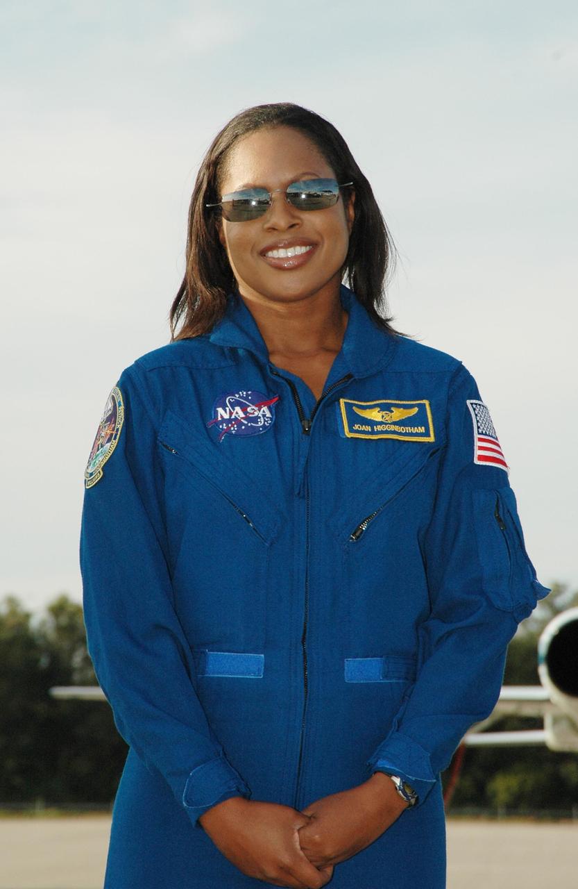 KENNEDY SPACE CENTER, FLA. -- After arrival at the Shuttle Landing Facility, STS-116 Mission Specialist Joan Higginbotham poses for the media. The crew has returned to KSC for the terminal countdown demonstration test, which are prelaunch preparations that include a simulated launch countdown.  Other crew members are Commander Mark Polansky, Pilot William Oefelein and Mission Specialists Sunita Williams, Nicholas Patrick, Christer Fuglesang and Robert Curbeam. Fuglesang, who is from Sweden, represents the European Space Agency. The mission is No. 20 to the International Space Station and construction flight 12A.1.  The mission payload is the SPACEHAB module, the P5 integrated truss structure and other key components. Launch is scheduled for no earlier than Dec. 7. Photo credit: NASA/Kim Shiflett
