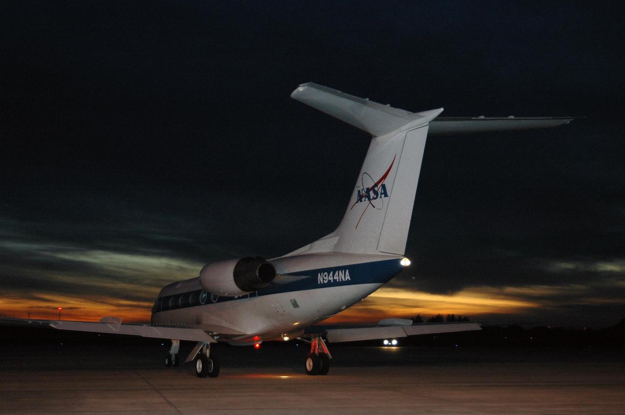 KENNEDY SPACE CENTER, FLA. -- At the Shuttle Landing Facility, the shuttle training aircraft taxis onto the runway.  Inside are STS-116 Pilot William Oefelein and Commander Mark Polansky, who are flying the aircraft to practice landing the orbiter.  The mission crew is at KSC for the terminal countdown demonstration test, which are prelaunch preparations that include a simulated launch countdown. STA practice is part of the TCDT. The STA is a Grumman American Aviation-built Gulf Stream II jet that was modified to simulate an orbiter's cockpit, motion and visual cues, and handling qualities. In flight, the STA duplicates the orbiter's atmospheric descent trajectory from approximately 35,000 feet altitude to landing on a runway. Because the orbiter is unpowered during re-entry and landing, its high-speed glide must be perfectly executed the first time. Photo credit: NASA/Kim Shiflett