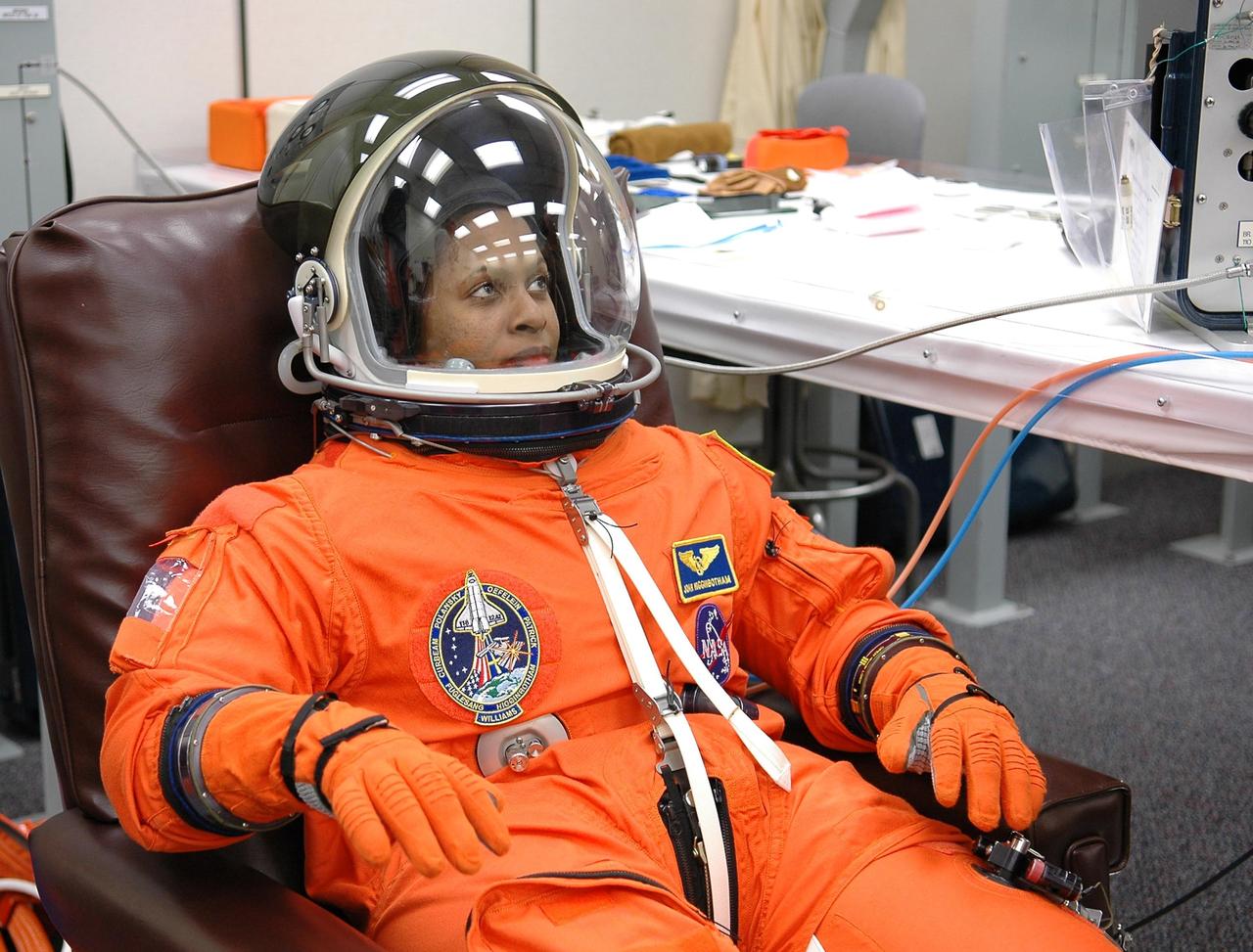 KENNEDY SPACE CENTER, FLA. -- STS-116 Mission Specialist Joan Higginbotham has donned her complete launch suit to check the fit, part of the prelaunch preparations during terminal countdown demonstration test (TCDT) activities.  The mission crew is at KSC for the TCDT, which includes a simulated launch countdown.  The STS-116 mission is No. 20 to the International Space Station and construction flight 12A.1.  The mission payload is the SPACEHAB module, the P5 integrated truss structure and other key components. Launch is scheduled for no earlier than Dec. 7.  Photo credit: NASA/Kim Shiflett