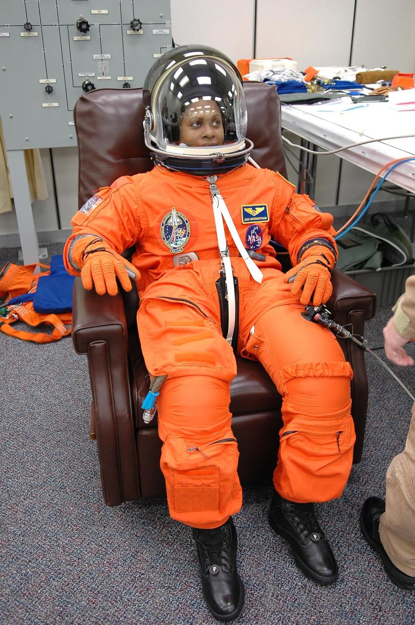 KENNEDY SPACE CENTER, FLA. -- STS-116 Mission Specialist Joan Higginbotham has donned her complete launch suit to check the fit, part of the prelaunch preparations during terminal countdown demonstration test (TCDT) activities.  The mission crew is at KSC for the TCDT, which includes a simulated launch countdown. The STS-116 mission is No. 20 to the International Space Station and construction flight 12A.1.  The mission payload is the SPACEHAB module, the P5 integrated truss structure and other key components. Launch is scheduled for no earlier than Dec. 7.  Photo credit: NASA/Kim Shiflett