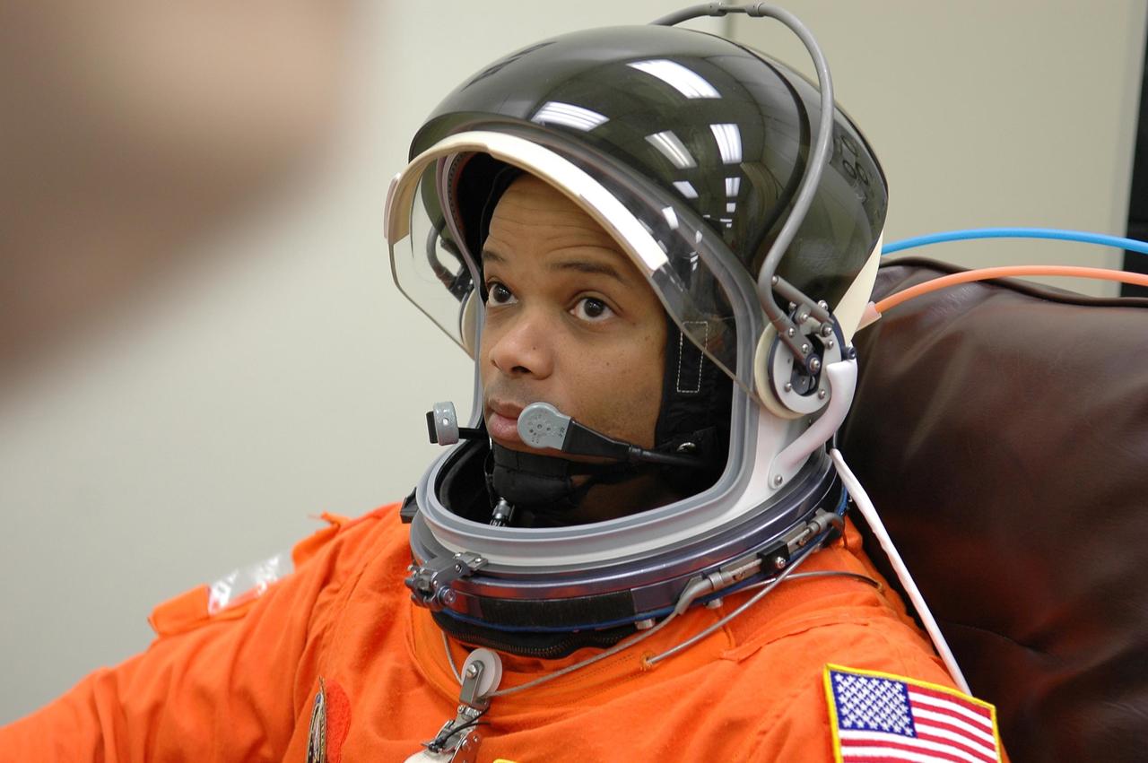 KENNEDY SPACE CENTER, FLA. -- STS-116 Mission Specialist Robert Curbeam checks the fit of his helmet during suit fit-check, part of the prelaunch preparations during terminal countdown demonstration test (TCDT) activities. The mission crew is at KSC for the TCDT, which includes a simulated launch countdown. The STS-116 mission is No. 20 to the International Space Station and construction flight 12A.1. The mission payload is the SPACEHAB module, the P5 integrated truss structure and other key components. Launch is scheduled for no earlier than Dec. 7. Photo credit: NASA/Kim Shiflett