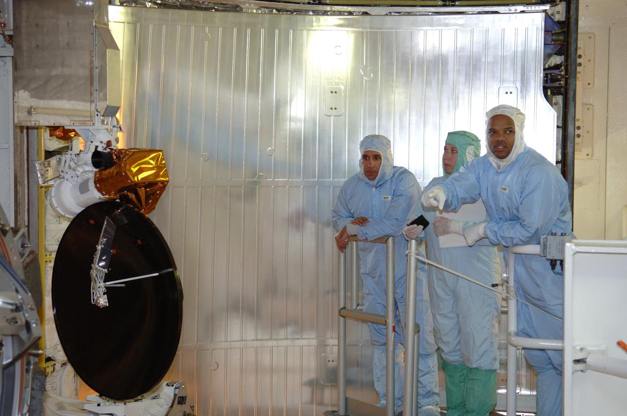 KENNEDY SPACE CENTER, FLA. -- In the payload changeout room on Launch Pad 39B, STS-116 crew members look over the mission payload one more time before launch. Pilot William Oefelein is at left and Mission Specialist Robert Curbeam is at right. The crew is at KSC to take part in Terminal Countdown Demonstration Test activities, which include emergency egress training, a simulated launch countdown and payload familiarization. The TCDT is part of prelaunch preparations for the mission that is scheduled to lift off in a window opening no earlier than Dec. 7.   The STS-116 mission is No. 20 to the International Space Station and construction flight 12A.1.  The mission payload is the SPACEHAB module, the P5 integrated truss structure and other key components.  Photo credit: NASA/Kim Shiflett