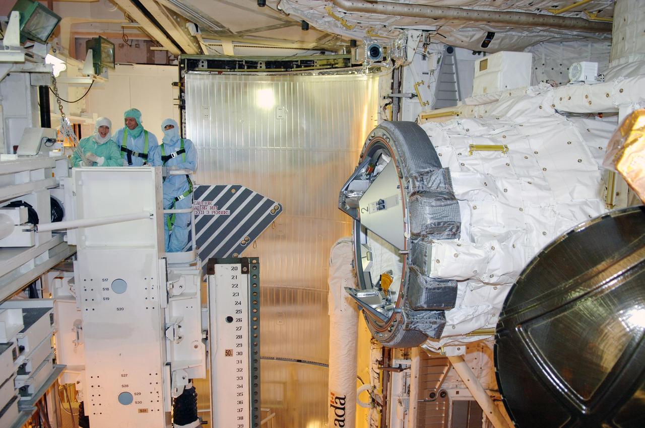KENNEDY SPACE CENTER, FLA. -- In the payload changeout room on Launch Pad 39B, STS-116 crew members look over the mission payload with payload managers one more time before launch. Mission Specialist Christer Fuglesang is in the center.The crew is at KSC to take part in Terminal Countdown Demonstration Test activities, which include emergency egress training, a simulated launch countdown and payload familiarization. The TCDT is part of prelaunch preparations for the mission that is scheduled to lift off in a window opening no earlier than Dec. 7.   The STS-116 mission is No. 20 to the International Space Station and construction flight 12A.1.  The mission payload is the SPACEHAB module, the P5 integrated truss structure and other key components.  Photo credit: NASA/Kim Shiflett