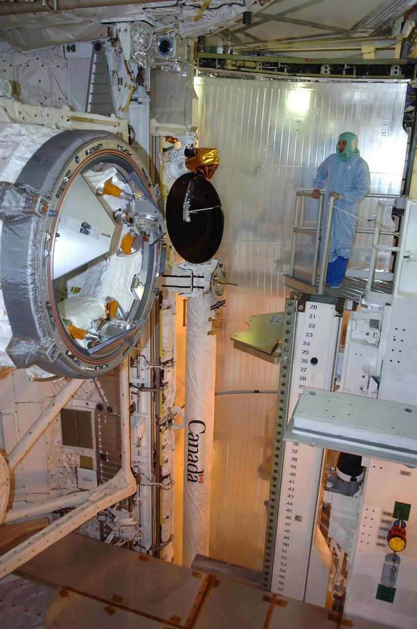 KENNEDY SPACE CENTER, FLA. -- In the payload changeout room on Launch Pad 39B, STS-116 Commander Mark Polansky looks over the mission payload one more time before launch. The crew is at KSC to take part in Terminal Countdown Demonstration Test activities, which include emergency egress training, a simulated launch countdown and payload familiarization. The TCDT is part of prelaunch preparations for the mission that is scheduled to lift off in a window opening no earlier than Dec. 7.   The STS-116 mission is No. 20 to the International Space Station and construction flight 12A.1.  The mission payload is the SPACEHAB module, the P5 integrated truss structure and other key components.  Photo credit: NASA/Kim Shiflett