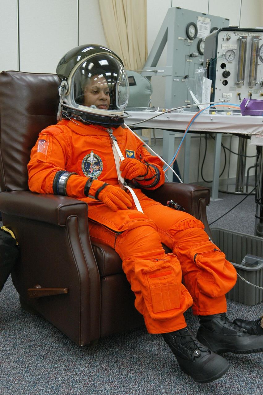KENNEDY SPACE CENTER, FLA. --  The STS-116 mission crew practices for launch with a simulation of activities, from crew breakfast and suit-up to countdown in the orbiter.  In this photo Mission Specialist Joan Higginbotham is suited up before heading to Launch Pad 39B. The STS-116 mission is No. 20 to the International Space Station and construction flight 12A.1.  The mission payload is the SPACEHAB module, the P5 integrated truss structure and other key components. Launch is scheduled for no earlier than Dec. 7. Photo credit: NASA/Kim Shiflett