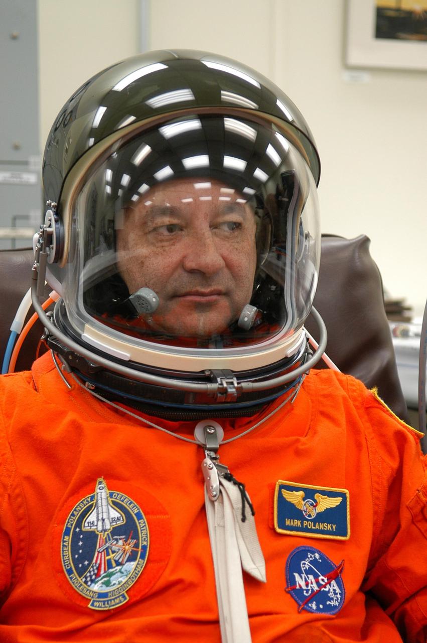 KENNEDY SPACE CENTER, FLA. -- The STS-116 mission crew practices for launch with a simulation of activities, from crew breakfast and suit-up to countdown in the orbiter. In this photo Commander Mark Polansky completes his suit fitting before heading to Launch Pad 39B. The STS-116 mission is No. 20 to the International Space Station and construction flight 12A.1. The mission payload is the SPACEHAB module, the P5 integrated truss structure and other key components. Launch is scheduled for no earlier than Dec. 7. Photo credit: NASA/Kim Shiflett