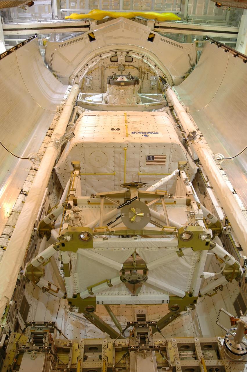 KENNEDY SPACE CENTER, FLA. -- With the payload successfully installed inside, the payload bay doors on Space Shuttle Discovery are closing.  Seen here are the SPACEHAB module on top and the P5 truss below.  Launch of Space Shuttle Discovery on mission STS-116 is scheduled no earlier than Dec. 7.  Photo credit: NASA/Dimitri Gerondidakis