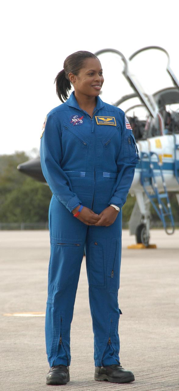 KENNEDY SPACE CENTER, FLA. --  At the Shuttle Landing Facility, STS-116 Mission Specialist Joan Higginbotham poses for media representatives following her arrival at KSC aboard a T-38 jet aircraft for the launch of Space Shuttle Discovery on Dec. 7.  On the mission, the STS-116 crew will deliver truss segment, P5, to the International Space Station and begin the intricate process of reconfiguring and redistributing the power generated by two pairs of U.S. solar arrays.  The P5 will be mated to the P4 truss that was delivered and attached during the STS-115 mission in September.  Photo credit: NASA/Kim Shiflett