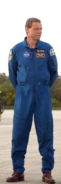 KENNEDY SPACE CENTER, FLA. -- At the Shuttle Landing Facility, STS-116 Mission Specialist Christer Fuglesang, a Swedish astronaut representing the European Space Agency, poses for media representatives following his arrival at KSC aboard a T-38 jet aircraft for the launch of Space Shuttle Discovery on Dec. 7. On the mission, the STS-116 crew will deliver truss segment, P5, to the International Space Station and begin the intricate process of reconfiguring and redistributing the power generated by two pairs of U.S. solar arrays. The P5 will be mated to the P4 truss that was delivered and attached during the STS-115 mission in September. Photo credit: NASA/Kim Shiflett