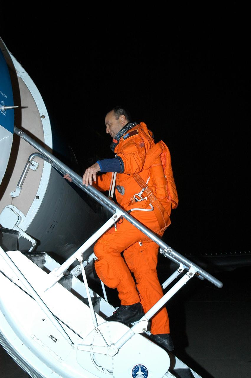 KENNEDY SPACE CENTER, FLA. --  STS-116 Commander Mark Polansky climbs toward the cockpit of the shuttle training aircraft (STA) to practice landing the orbiter. The STA is a Grumman American Aviation-built Gulf Stream II jet that was modified to simulate an orbiter's cockpit, motion and visual cues, and handling qualities. In flight, the STA duplicates the orbiter's atmospheric descent trajectory from approximately 35,000 feet altitude to landing on a runway. Because the orbiter is unpowered during re-entry and landing, its high-speed glide must be perfectly executed the first time. Launch of Space Shuttle Discovery on mission STS-116 is scheduled for 9:35 p.m. Dec. 7. On the mission, the STS-116 crew will deliver truss segment, P5, to the International Space Station and begin the intricate process of reconfiguring and redistributing the power generated by two pairs of U.S. solar arrays. The P5 will be mated to the P4 truss that was delivered and attached during the STS-115 mission in September. Photo credit: NASA/Kim Shiflett