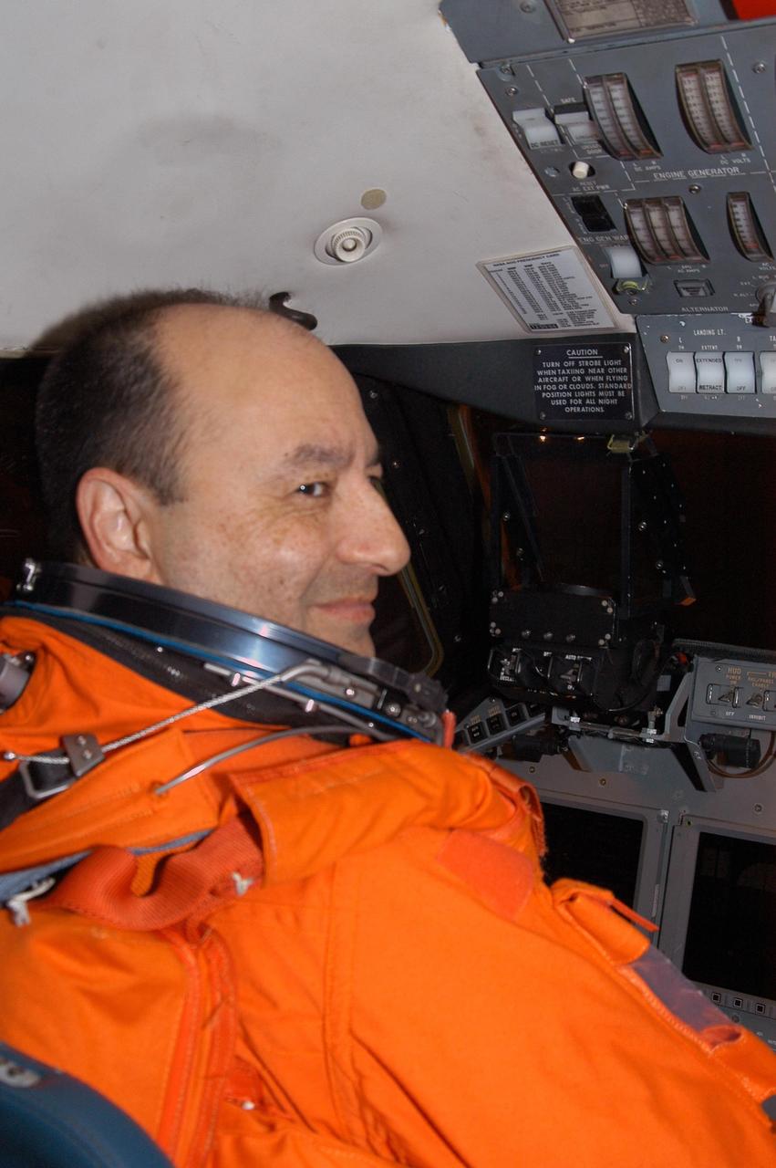 KENNEDY SPACE CENTER, FLA. --  STS-116 Commander Mark Polansky settles in the cockpit of the shuttle training aircraft (STA) before taking off to practice landing the orbiter.  The STA is a Grumman American Aviation-built Gulf Stream II jet that was modified to simulate an orbiter's cockpit, motion and visual cues, and handling qualities. In flight, the STA duplicates the orbiter's atmospheric descent trajectory from approximately 35,000 feet altitude to landing on a runway. Because the orbiter is unpowered during re-entry and landing, its high-speed glide must be perfectly executed the first time. Launch of Space Shuttle Discovery on mission STS-116 is scheduled for 9:35 p.m. Dec. 7. On the mission, the STS-116 crew will deliver truss segment, P5, to the International Space Station and begin the intricate process of reconfiguring and redistributing the power generated by two pairs of U.S. solar arrays. The P5 will be mated to the P4 truss that was delivered and attached during the STS-115 mission in September. Photo credit: NASA/Kim Shiflett