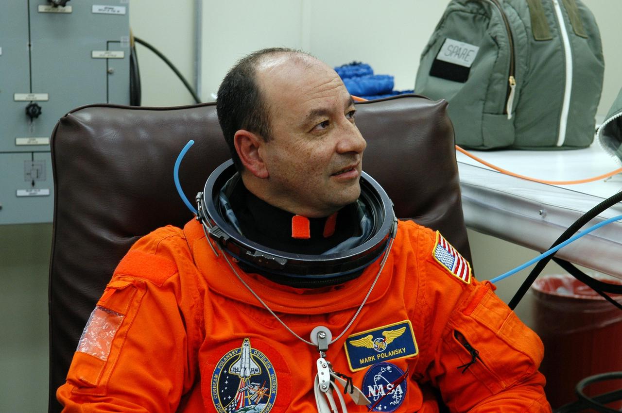 KENNEDY SPACE CENTER, FLA. --    STS-116 Commander Mark Polansky is getting a suit fit-check after practicing landing the orbiter at the controls of the shuttle training aircraft. The STA is a Grumman American Aviation-built Gulf Stream II jet that was modified to simulate an orbiter's cockpit, motion and visual cues, and handling qualities. In flight, the STA duplicates the orbiter's atmospheric descent trajectory from approximately 35,000 feet altitude to landing on a runway. Because the orbiter is unpowered during re-entry and landing, its high-speed glide must be perfectly executed the first time. Launch of Space Shuttle Discovery on mission STS-116 is scheduled for 9:35 p.m. Dec. 7. On the mission, the STS-116 crew will deliver truss segment, P5, to the International Space Station and begin the intricate process of reconfiguring and redistributing the power generated by two pairs of U.S. solar arrays. The P5 will be mated to the P4 truss that was delivered and attached during the STS-115 mission in September. Photo credit: NASA/Kim Shiflett