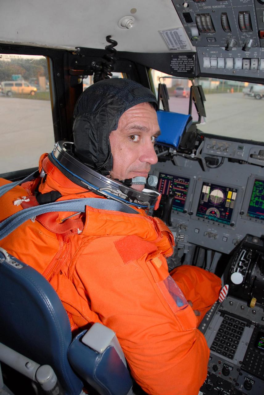 KENNEDY SPACE CENTER, FLA. --  STS-116 Pilot William Oefelein settles in the cockpit of the shuttle training aircraft (STA) before taking off for orbiter landing practice. The STA is a Grumman American Aviation-built Gulf Stream II jet that was modified to simulate an orbiter's cockpit, motion and visual cues, and handling qualities. In flight, the STA duplicates the orbiter's atmospheric descent trajectory from approximately 35,000 feet altitude to landing on a runway. Because the orbiter is unpowered during re-entry and landing, its high-speed glide must be perfectly executed the first time. Launch of Space Shuttle Discovery on mission STS-116 is scheduled for 9:35 p.m. Dec. 7. On the mission, the STS-116 crew will deliver truss segment, P5, to the International Space Station and begin the intricate process of reconfiguring and redistributing the power generated by two pairs of U.S. solar arrays. The P5 will be mated to the P4 truss that was delivered and attached during the STS-115 mission in September. Photo credit: NASA/Kim Shiflett