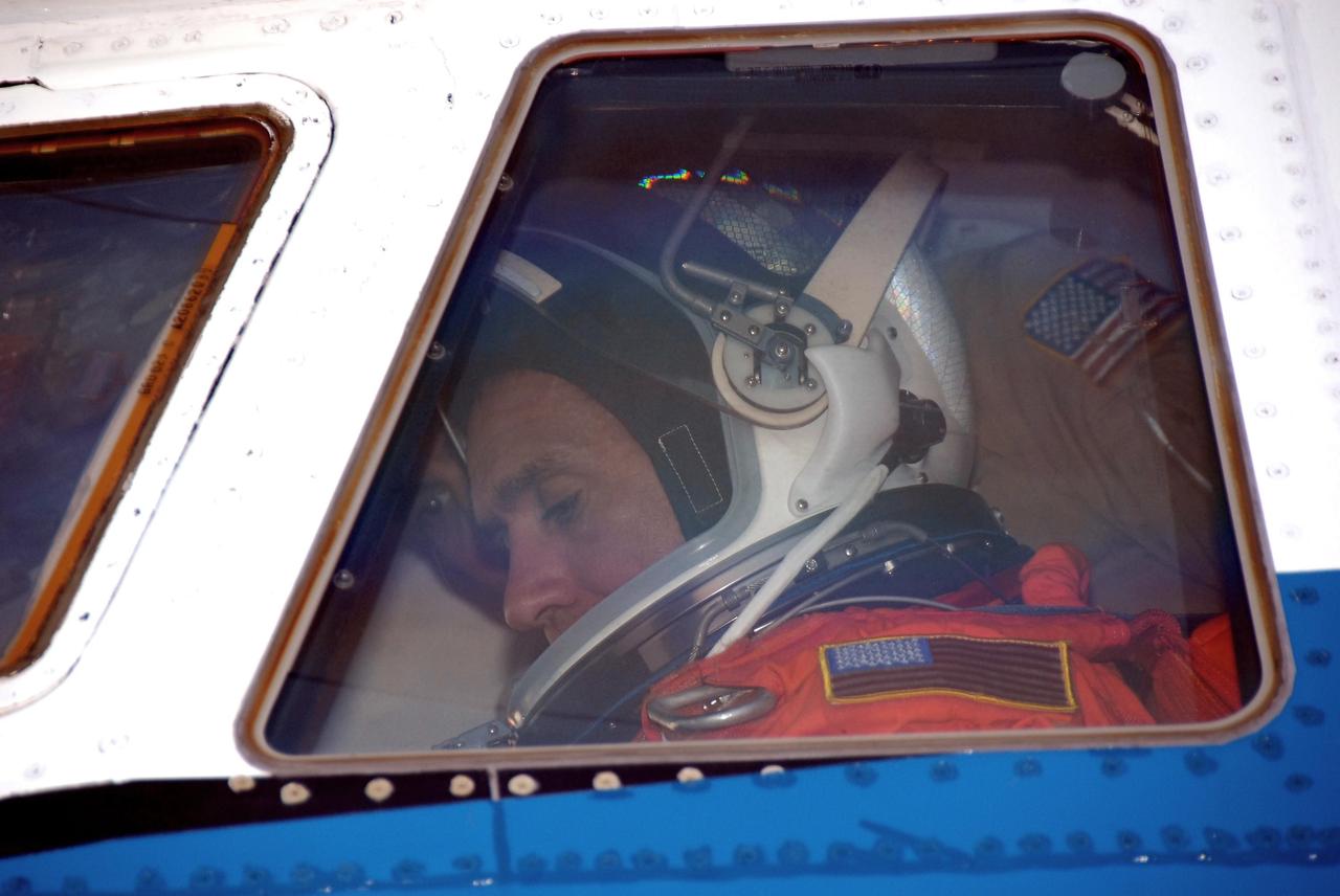 KENNEDY SPACE CENTER, FLA. --  STS-116 Pilot William Oefelein settles in the cockpit of the shuttle training aircraft (STA) before taking off for orbiter landing practice. The STA is a Grumman American Aviation-built Gulf Stream II jet that was modified to simulate an orbiter's cockpit, motion and visual cues, and handling qualities. In flight, the STA duplicates the orbiter's atmospheric descent trajectory from approximately 35,000 feet altitude to landing on a runway. Because the orbiter is unpowered during re-entry and landing, its high-speed glide must be perfectly executed the first time. Launch of Space Shuttle Discovery on mission STS-116 is scheduled for 9:35 p.m. Dec. 7. On the mission, the STS-116 crew will deliver truss segment, P5, to the International Space Station and begin the intricate process of reconfiguring and redistributing the power generated by two pairs of U.S. solar arrays. The P5 will be mated to the P4 truss that was delivered and attached during the STS-115 mission in September. Photo credit: NASA/Kim Shiflett