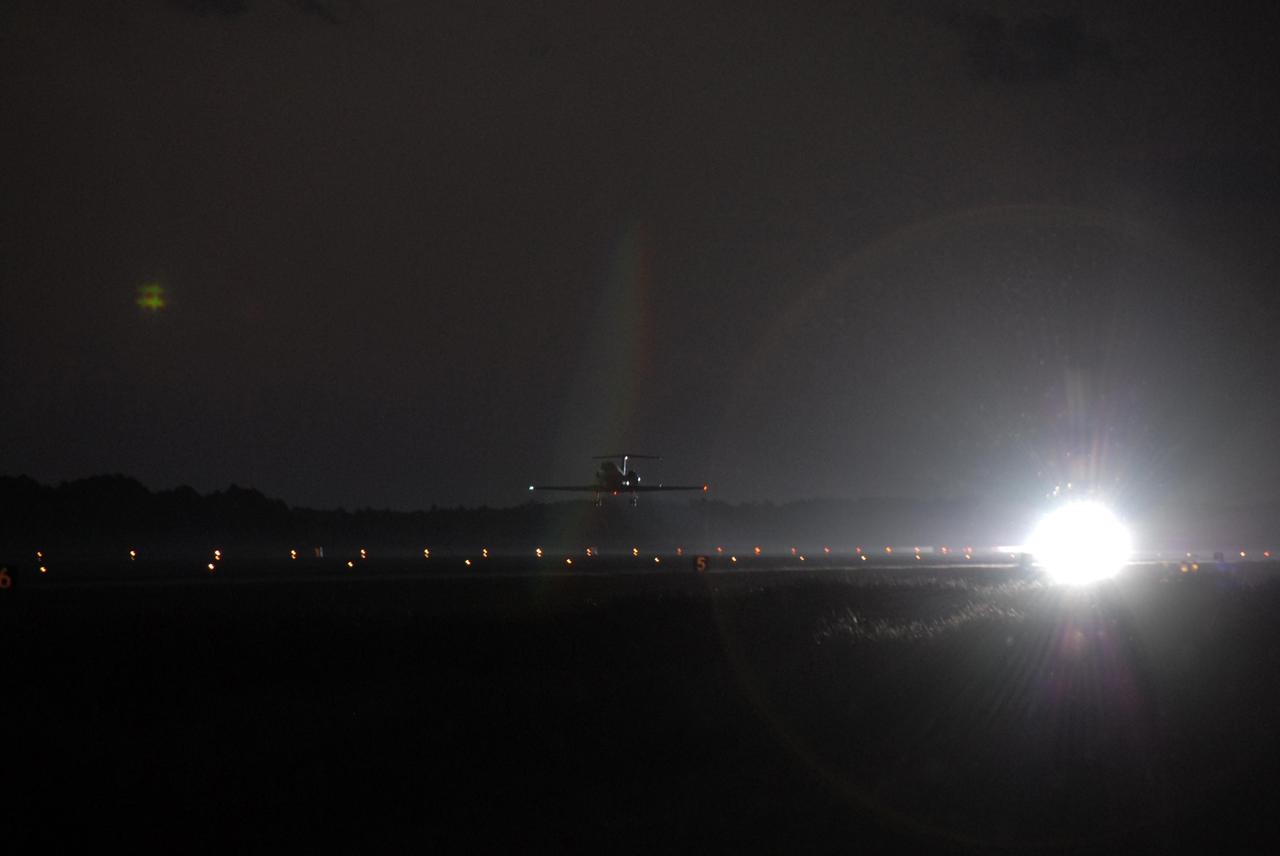 KENNEDY SPACE CENTER, FLA. --   After the first practice orbiter landing, STS-116 Pilot William Oefelein heads the shuttle training aircraft (STA) back into the night sky to do it again. The STA is a Grumman American Aviation-built Gulf Stream II jet that was modified to simulate an orbiter's cockpit, motion and visual cues, and handling qualities. In flight, the STA duplicates the orbiter's atmospheric descent trajectory from approximately 35,000 feet altitude to landing on a runway. Because the orbiter is unpowered during re-entry and landing, its high-speed glide must be perfectly executed the first time. Launch of Space Shuttle Discovery on mission STS-116 is scheduled for 9:35 p.m. Dec. 7. On the mission, the STS-116 crew will deliver truss segment, P5, to the International Space Station and begin the intricate process of reconfiguring and redistributing the power generated by two pairs of U.S. solar arrays. The P5 will be mated to the P4 truss that was delivered and attached during the STS-115 mission in September. Photo credit: NASA/Kim Shiflett