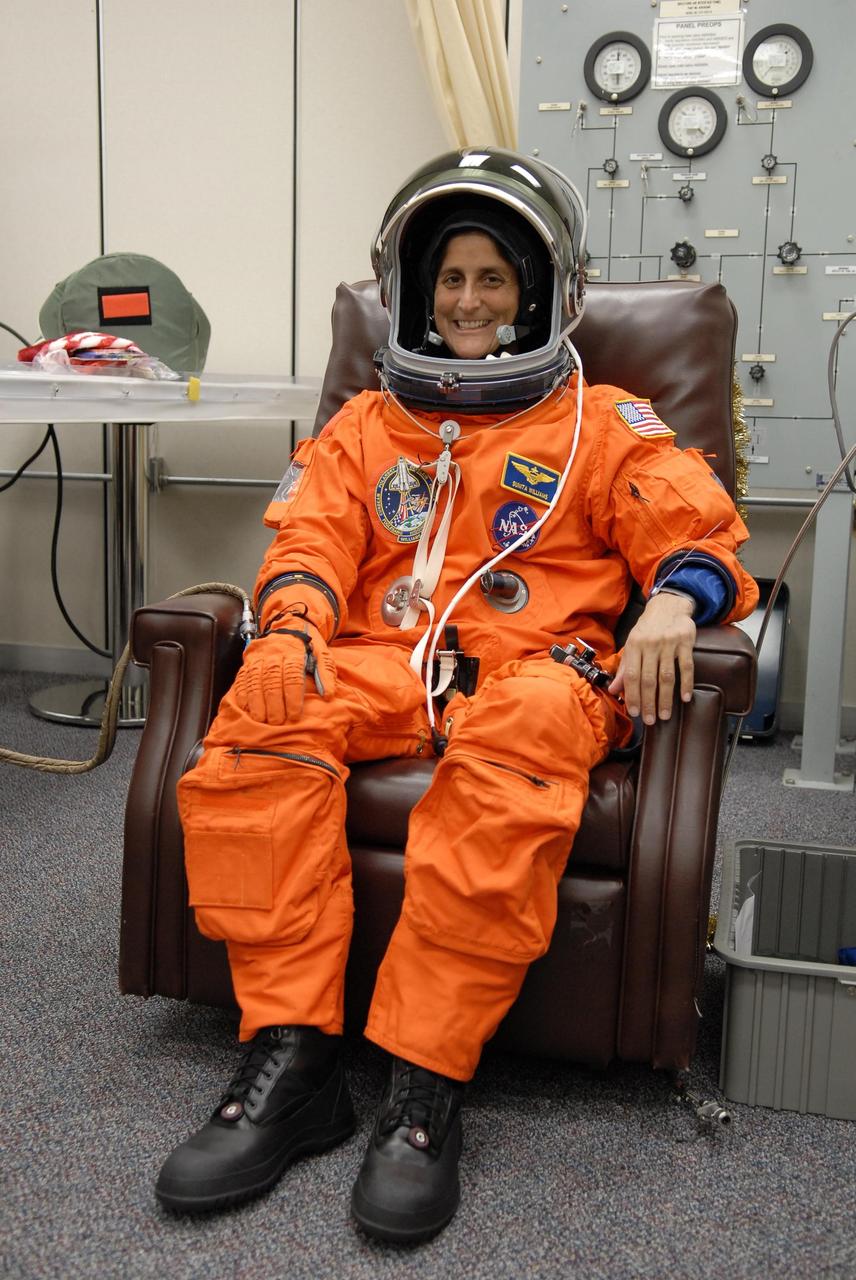 KENNEDY SPACE CENTER, FLA. -- The crew members of mission STS-116 are suiting up for launch at 9:35 p.m. EST from Launch Pad 39B aboard Space Shuttle Discovery. Pictured here is Mission Specialist Sunita Williams, who will be making her first shuttle flight. This is Discovery's 33rd mission and the first night launch since 2003. The 20th shuttle mission to the International Space Station, STS-116 carries another truss segment, P5. It will serve as a spacer, mated to the P4 truss that was attached in September. After installing the P5, the crew will reconfigure and redistribute the power generated by two pairs of U.S. solar arrays. Landing is expected Dec. 19 at KSC. Photo credit: NASA/Kim Shiflett
